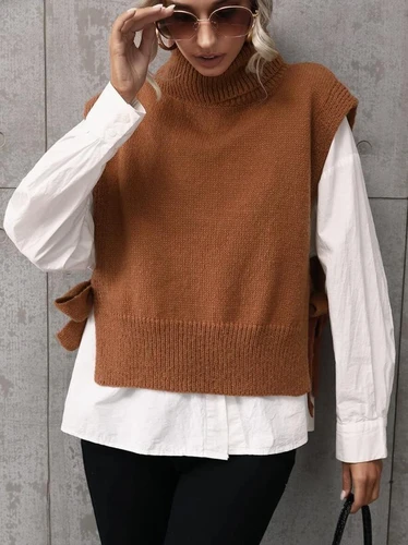 Plain turtleneck side button down jacket. Elegant sleeveless jacket for spring a